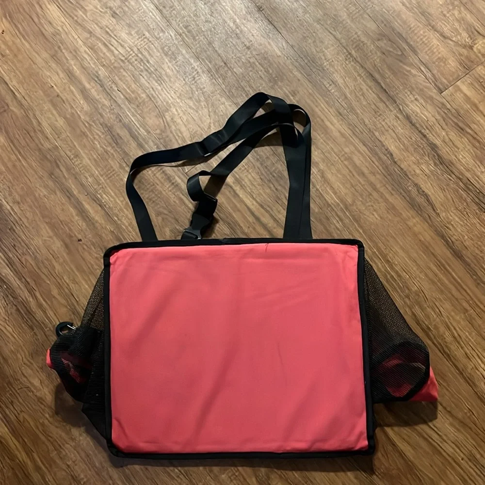 Dog car seat and the strap go over the back and front seat